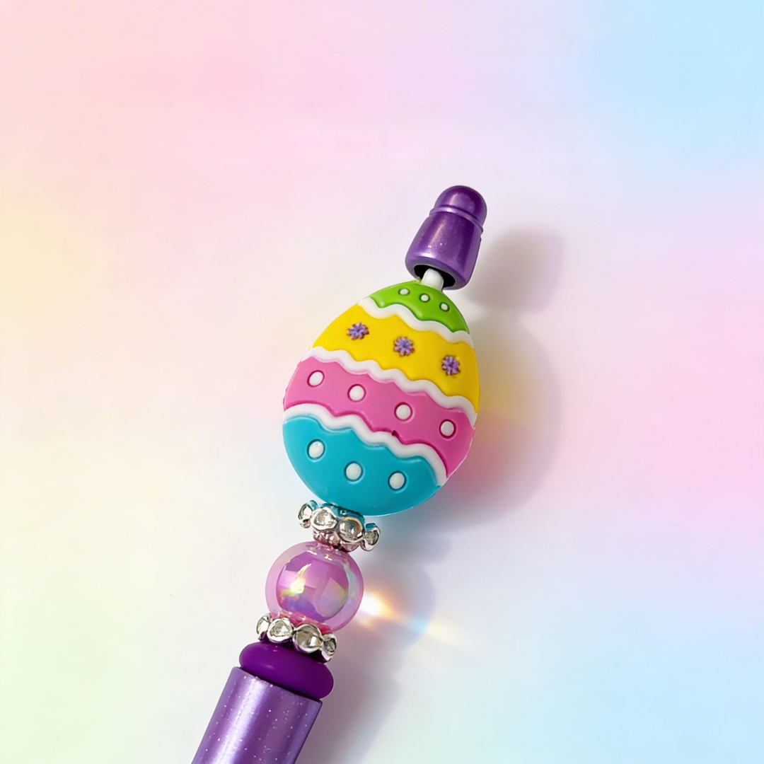 Colorful pen top with decorative elements on a gradient background