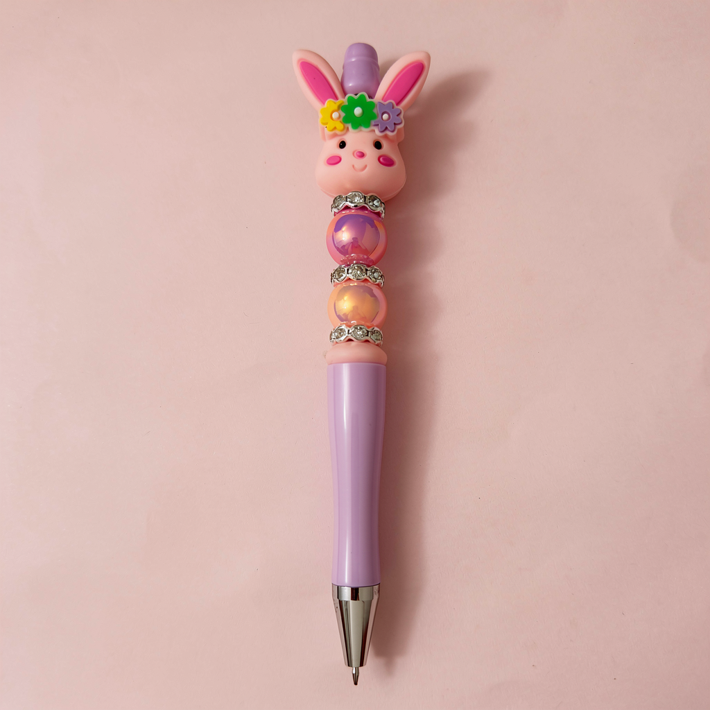 Decorative pen with a rabbit design on a pink background