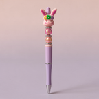 Decorative pen with a rabbit design on a gradient background