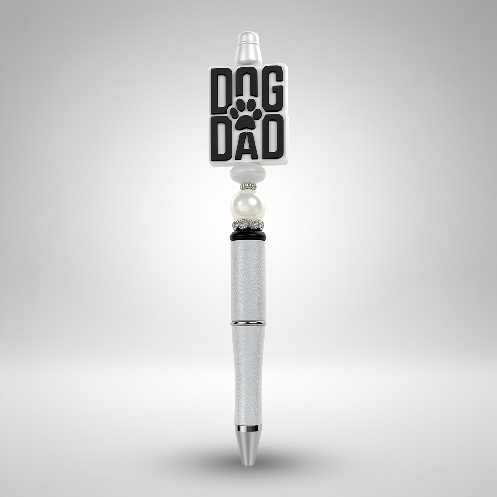 Pen with 'Dog Dad' and paw print design on a gray background