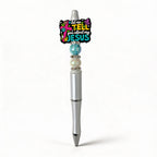 Pen with decorative top featuring text and beads on a white background