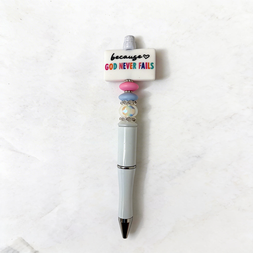 Pen with decorative top on a white background