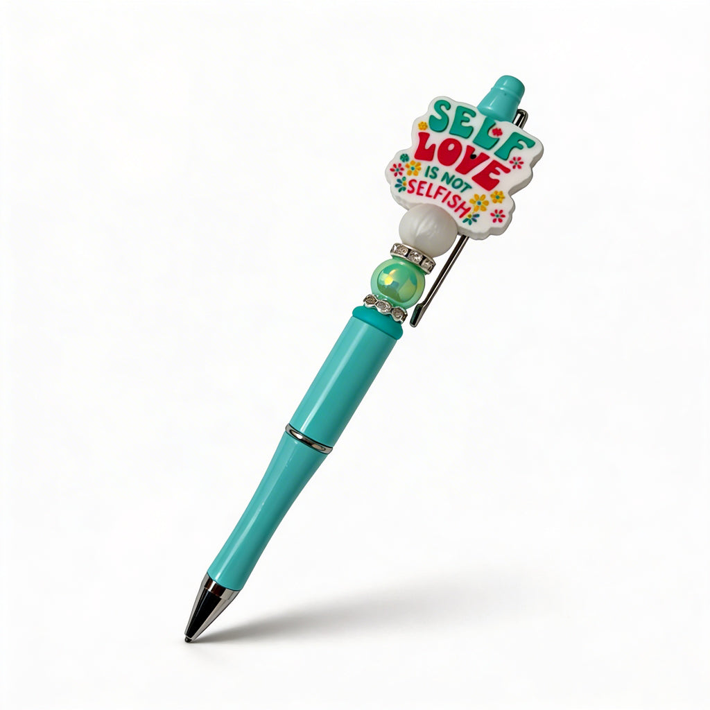 Turquoise pen with colorful heart-shaped clip on a white background