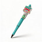 Turquoise pen with colorful heart-shaped clip on a white background
