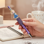 Hand writing with princess rhinestone decorative pen on notebook